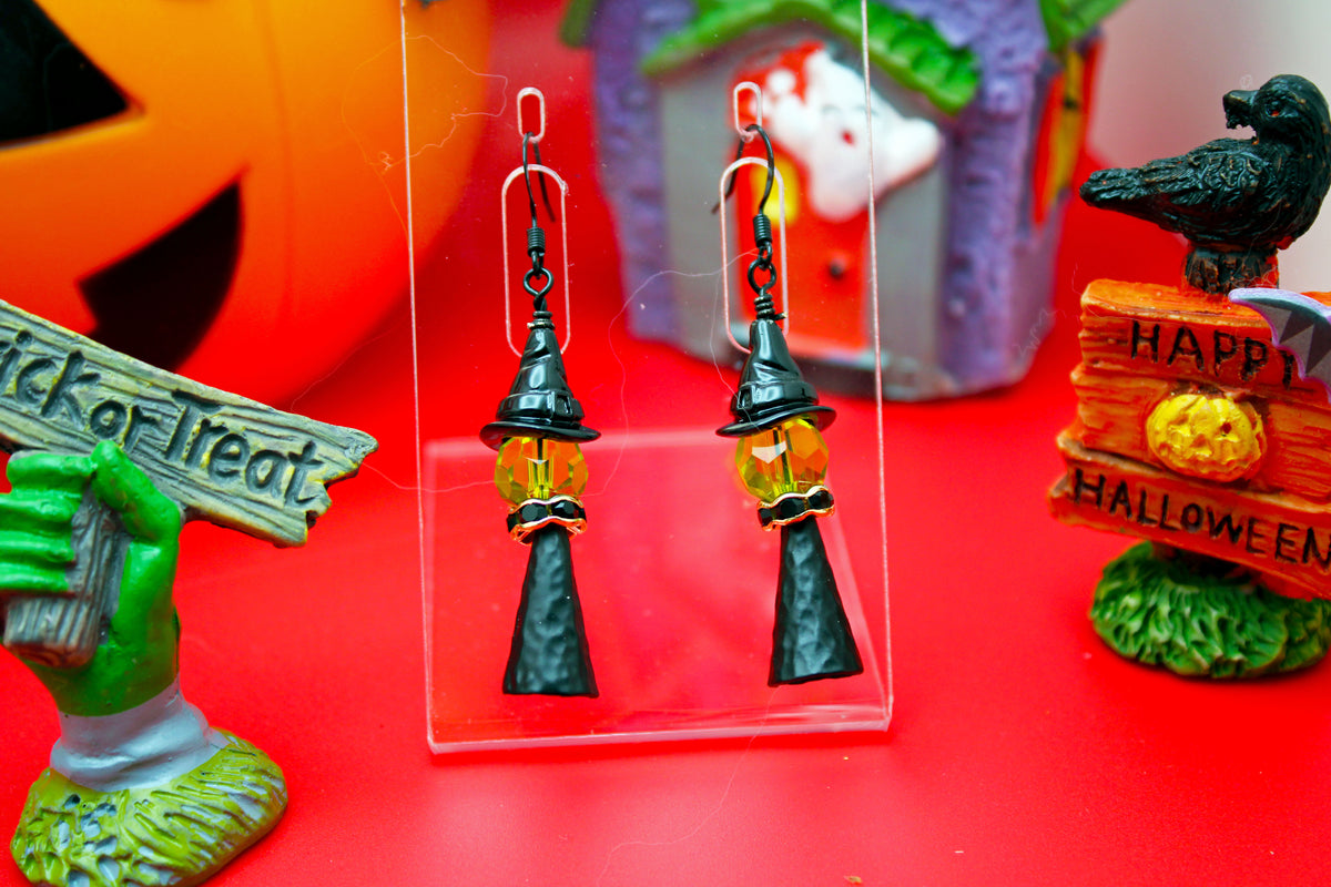 Witch with a black witch hat and gold accents