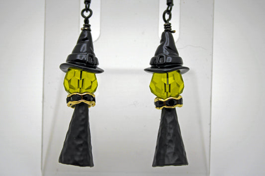 Witch with a black witch hat and gold accents