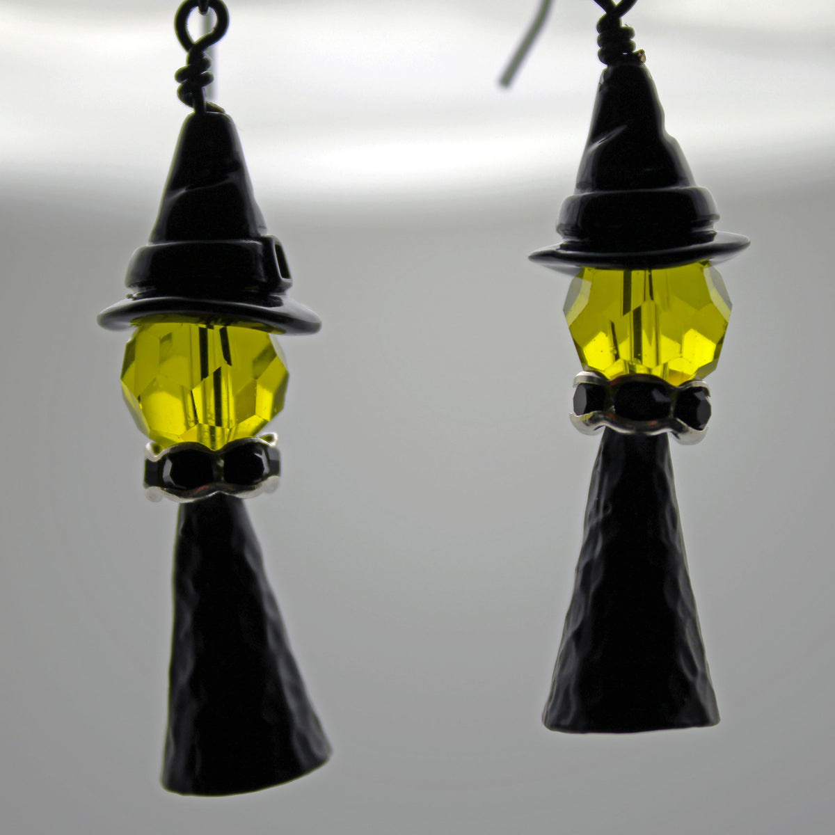 Witch with a black witch hat and silver accents